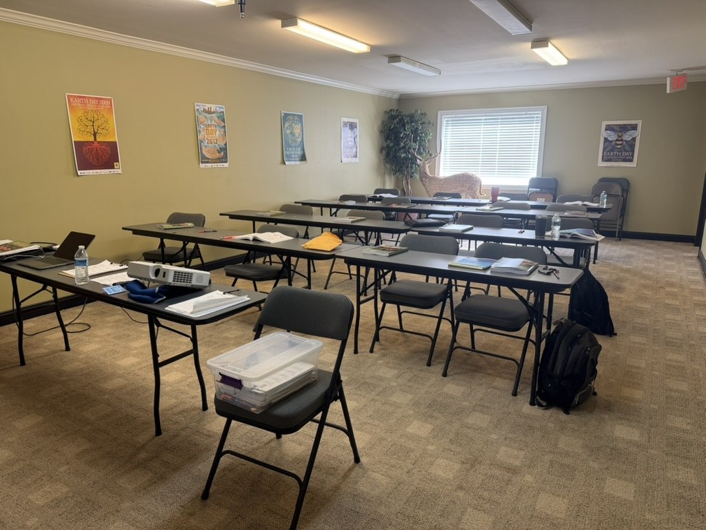 Classroom with course materials set out on tables for backflow training