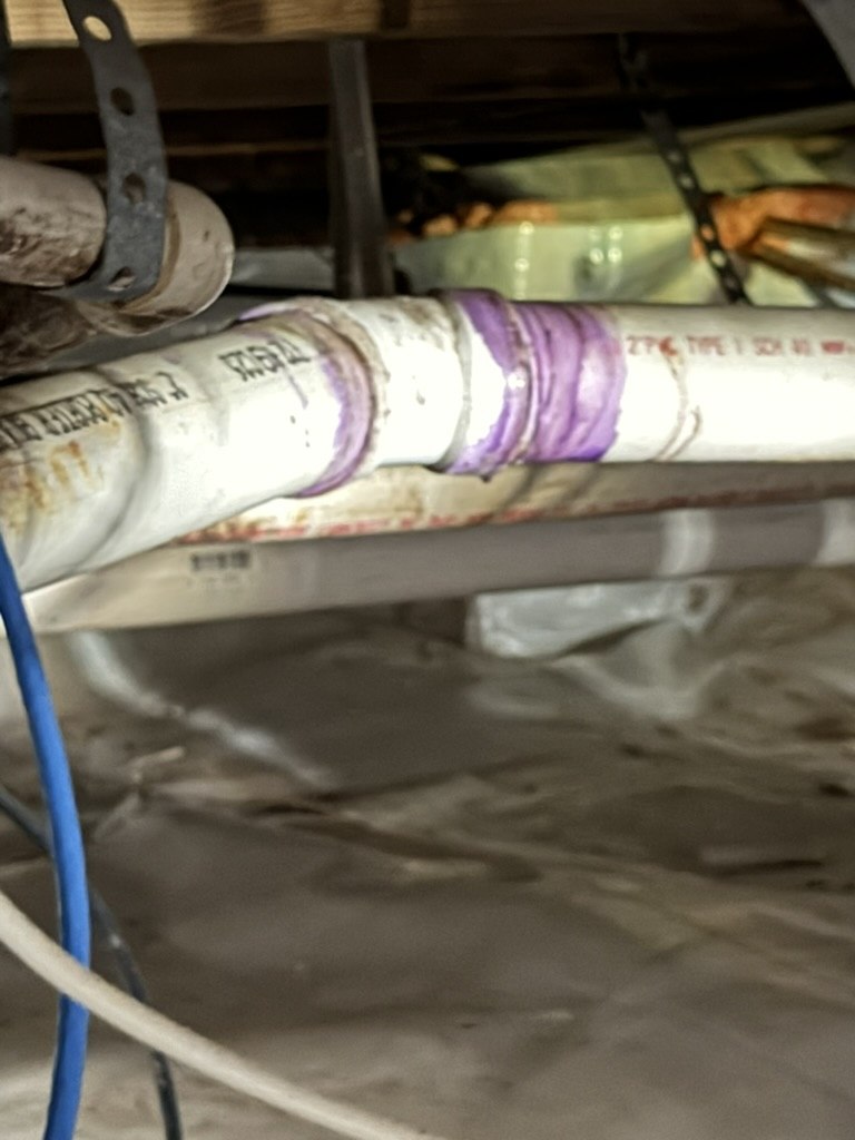 Close view of a drain fitting beneath the medical office