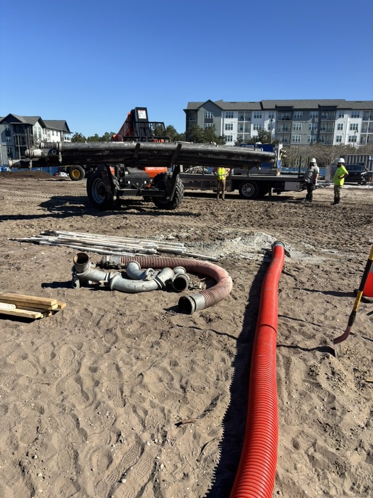 Wellpoint pipes, hoses and fittings being gathered for removal at the Nocatee construction site
