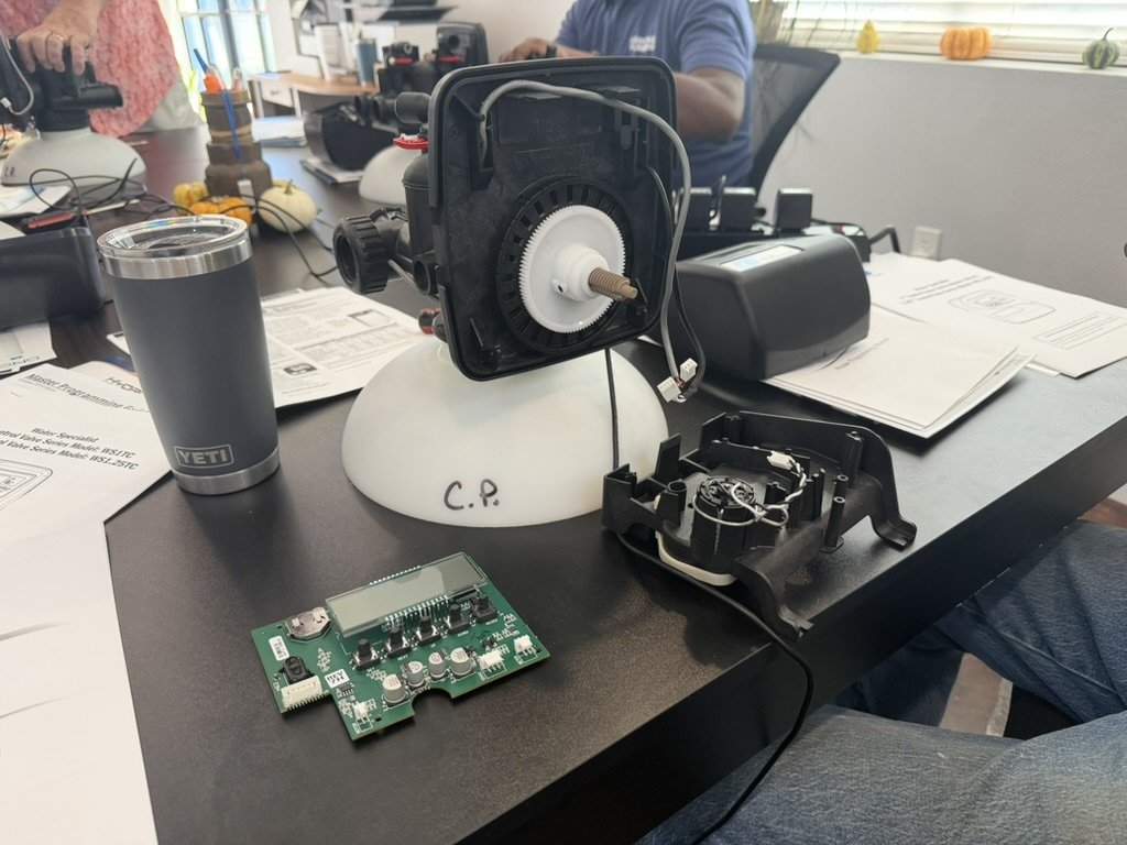 Water-treatment control valve, circuit board, and components laid out during Coast Pump refresher training
