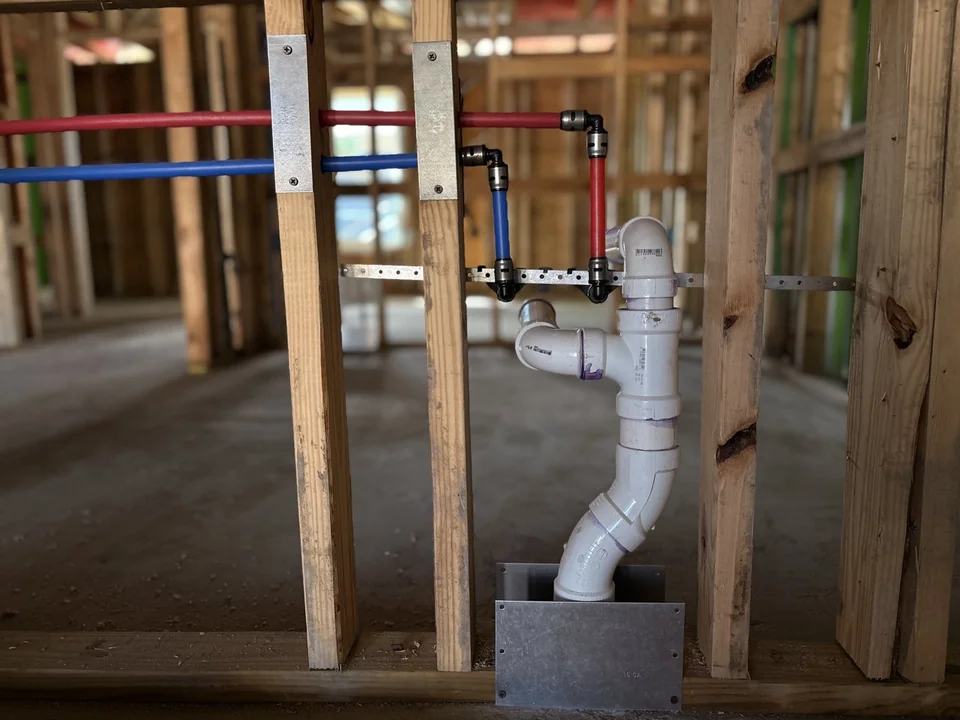 Sink water supply and drain rough-in in wood wall framing
