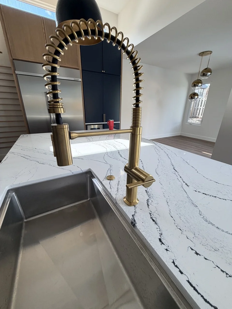 Kitchen faucet and sink installed by Advantage Plumbing in a new home