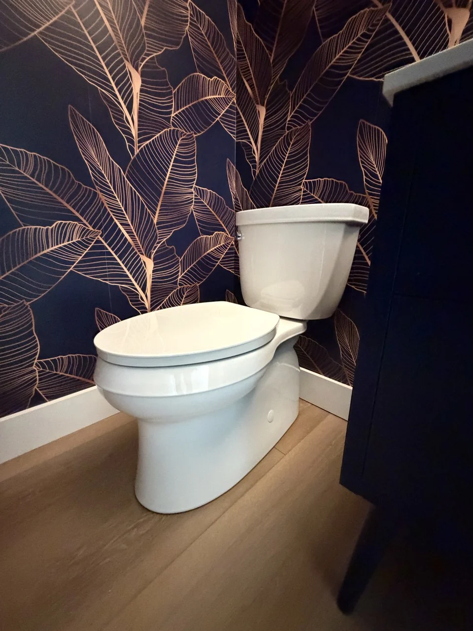 A new toilet installed by Advantage Plumbing in a finished bathroom
