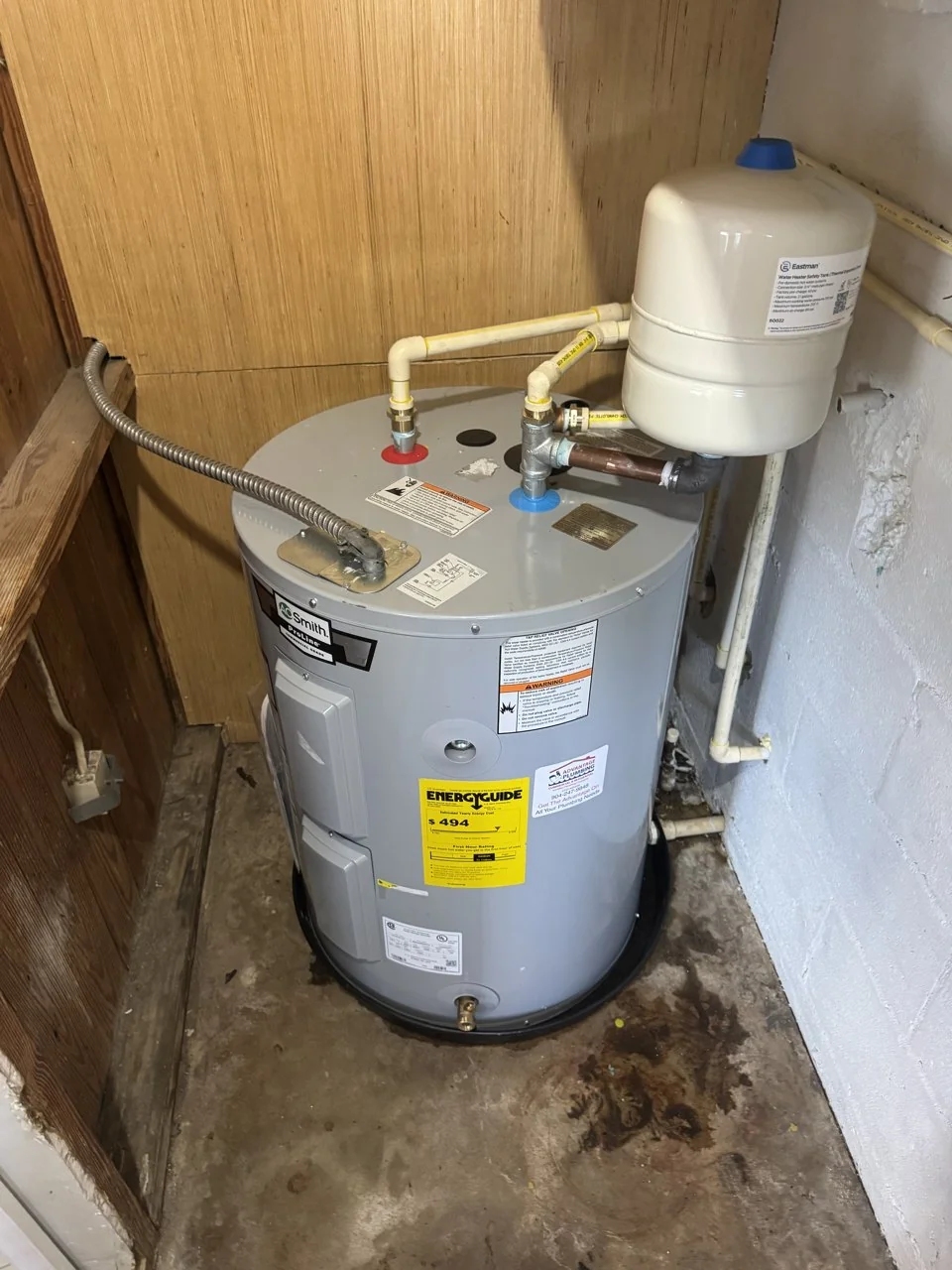 Replacement tank water heater with expansion tank, drain pan, and updated piping